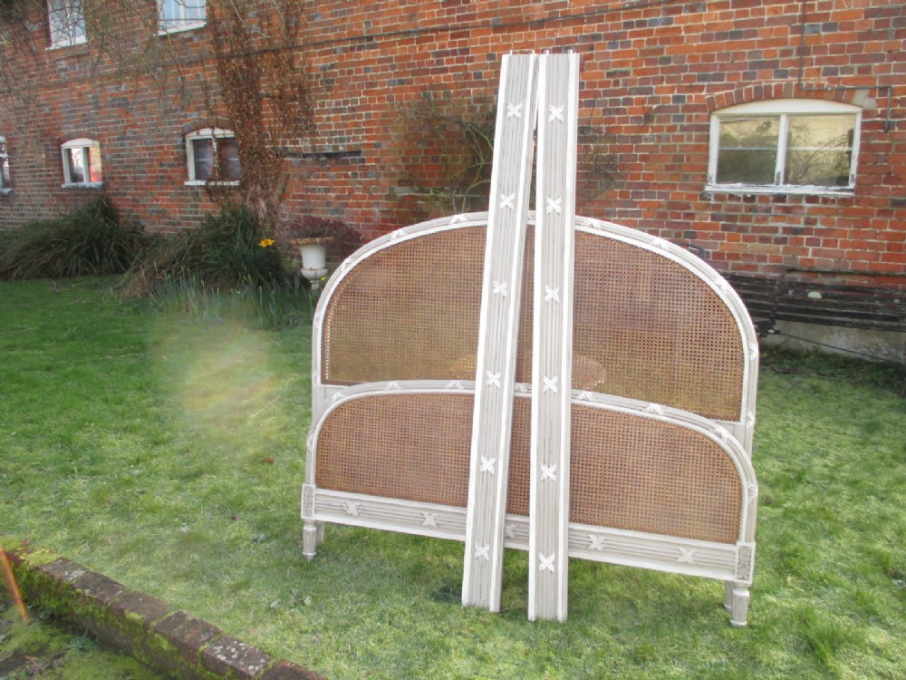 King-size caned and painted bed