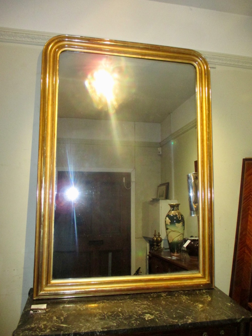 A tall and wide French mirror