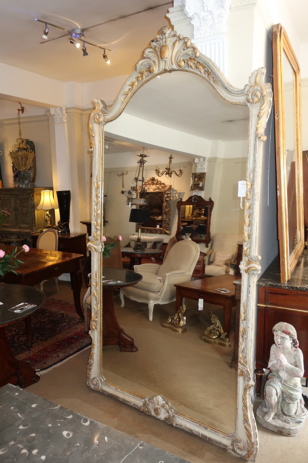Very large painted and gilded mirror