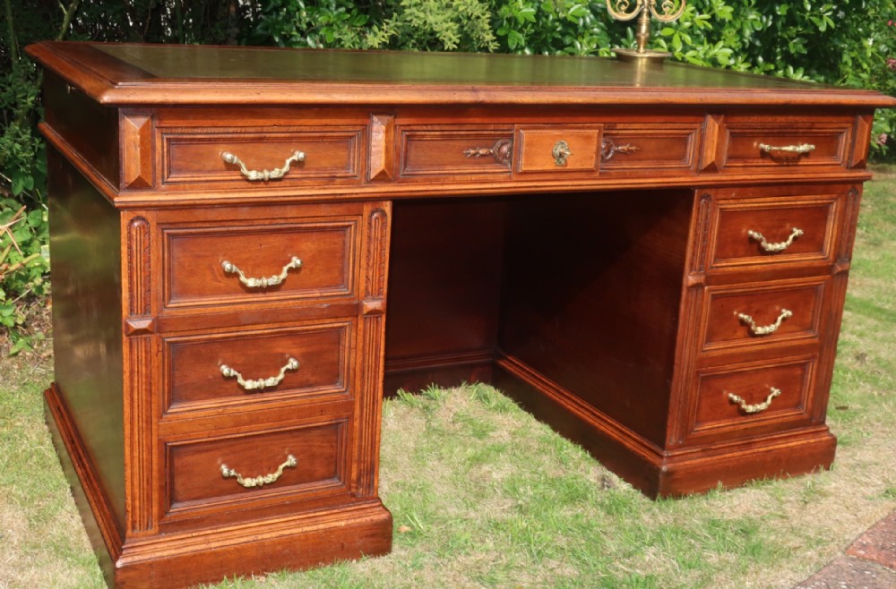 Large walnut pedestal desk