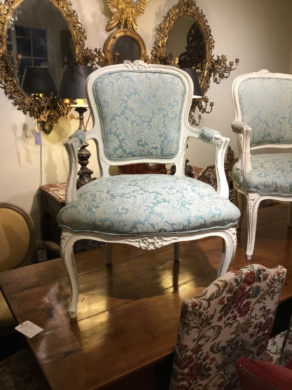 A pair of pretty French open armchairs  View II