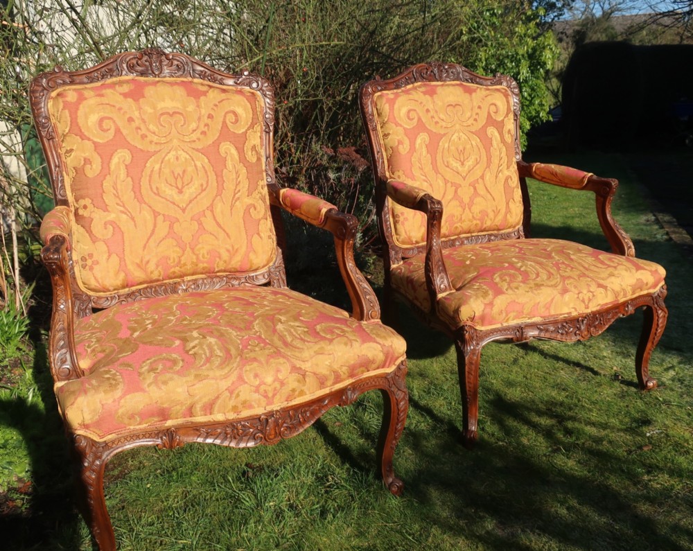 Pair of large walnut armchairs 
