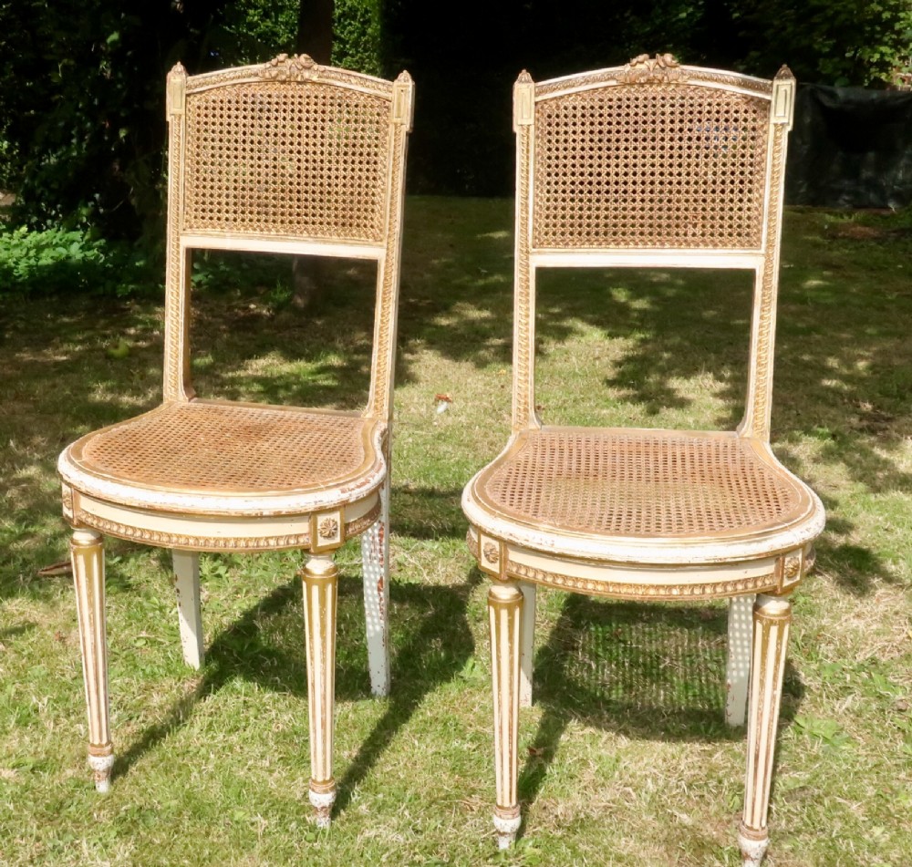 Pretty pair of caned chairs 