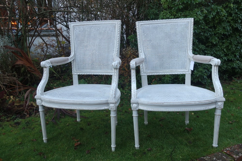 Pair of painted cane armchairs 