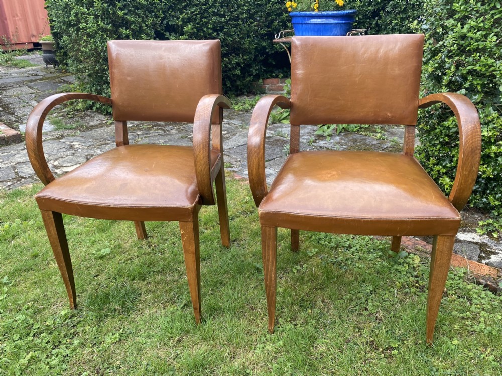 Pair of leather bridge chairs 