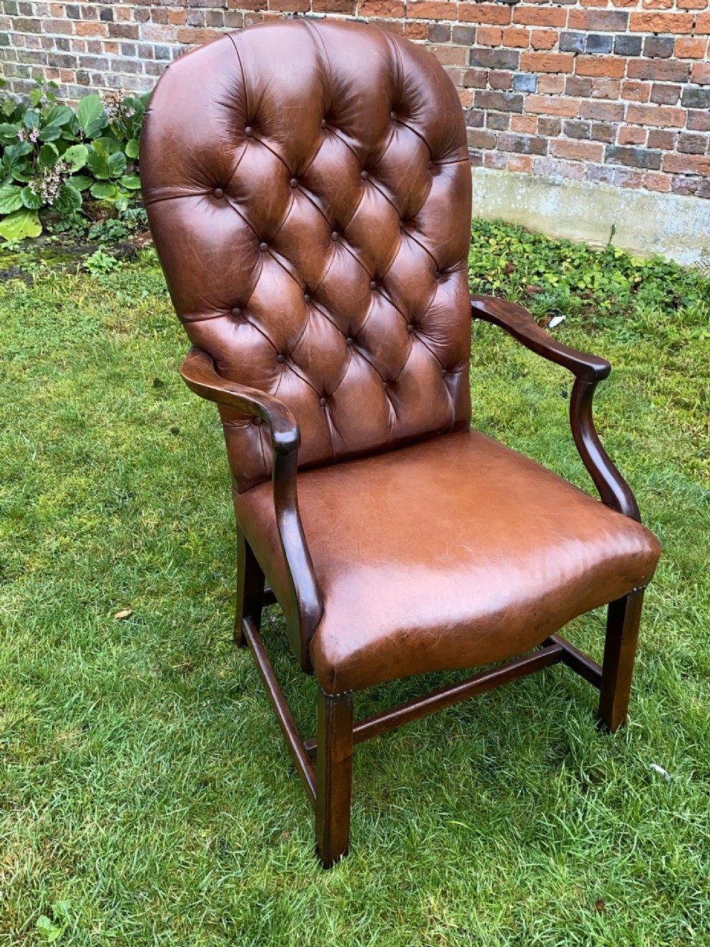 Leather button back armchair 