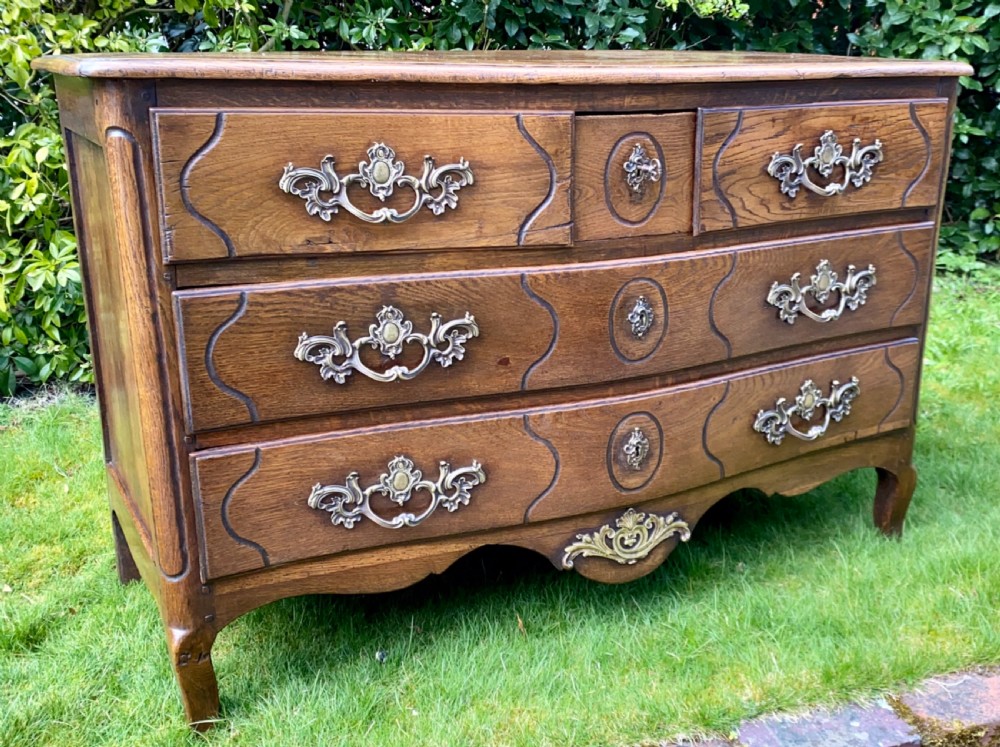 Louis XV serpentine fronted commode in oak 