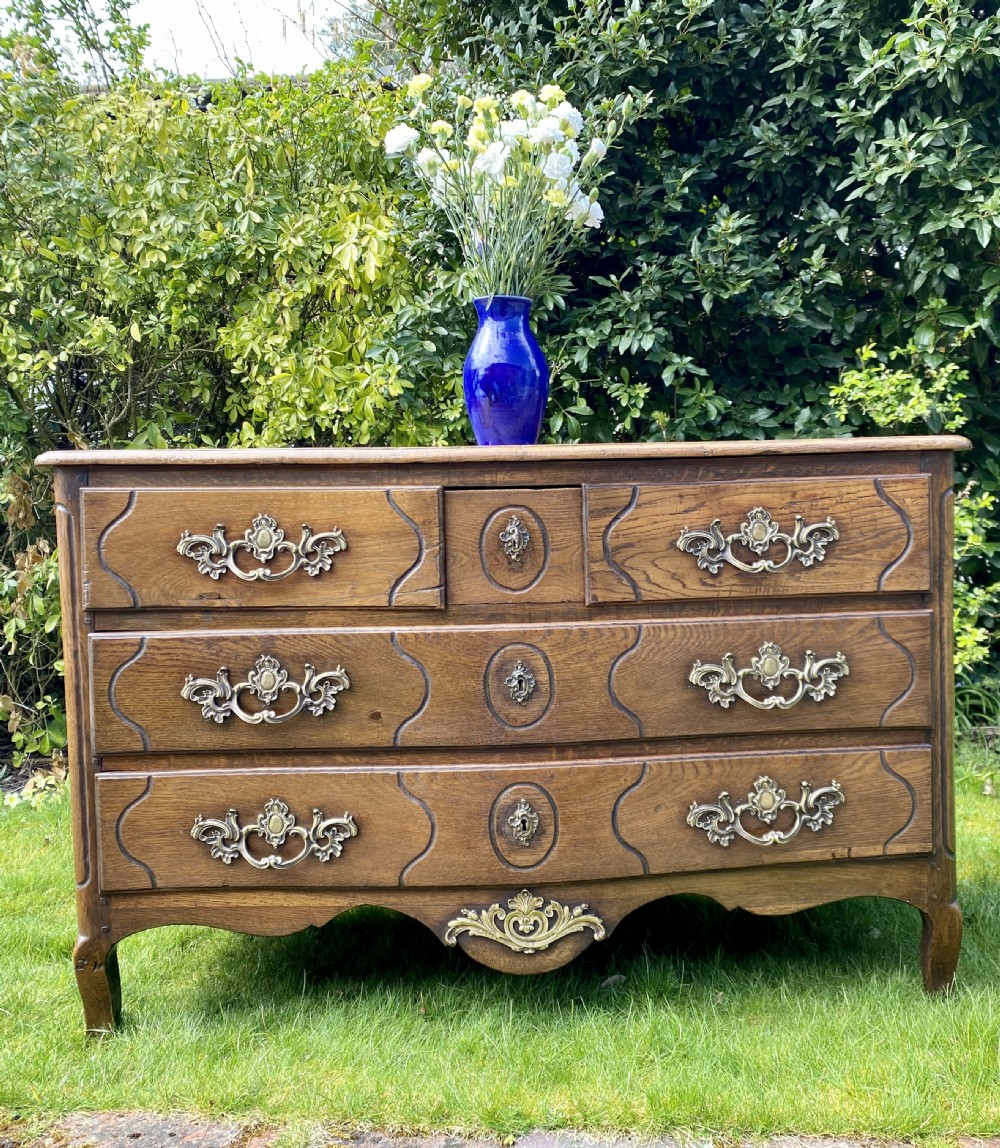 Louis XV serpentine fronted commode in oak  View II