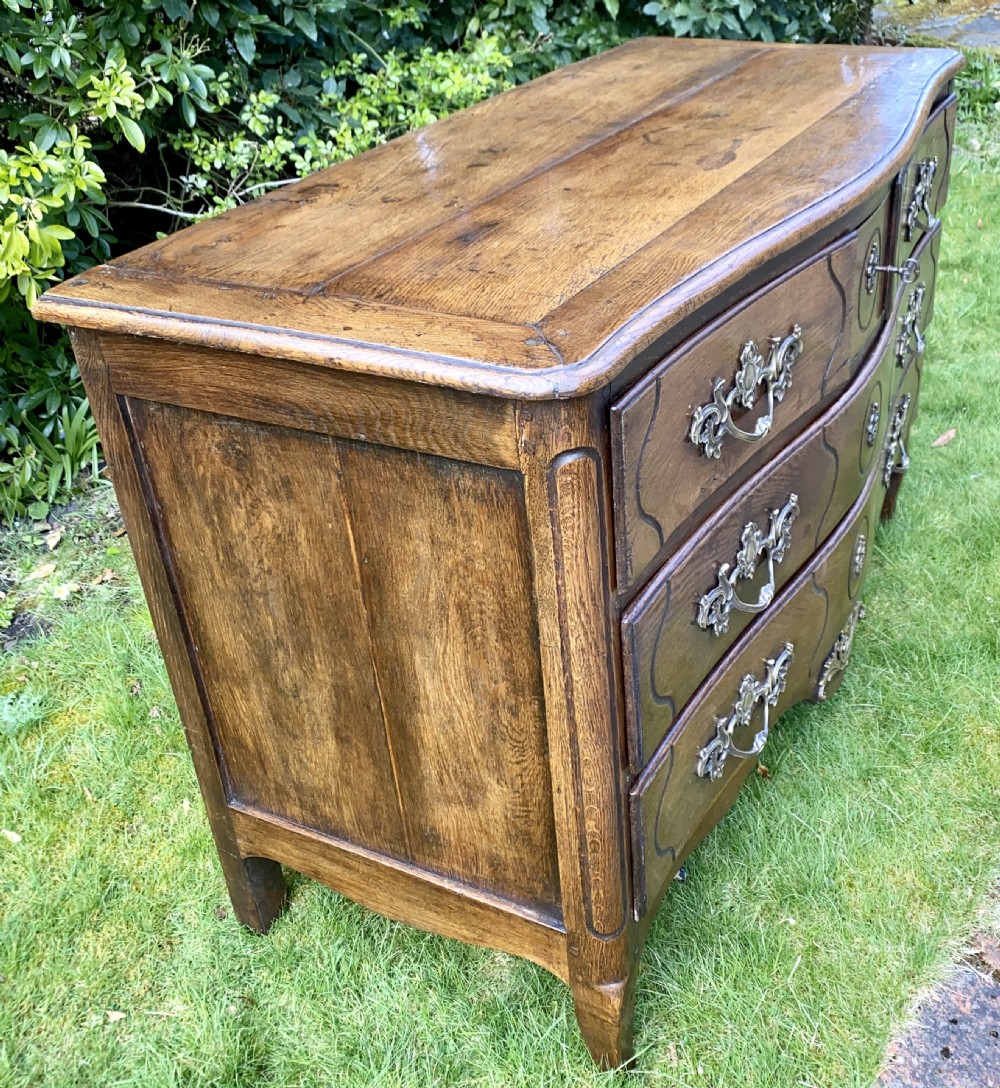 Louis XV serpentine fronted commode in oak  View IV