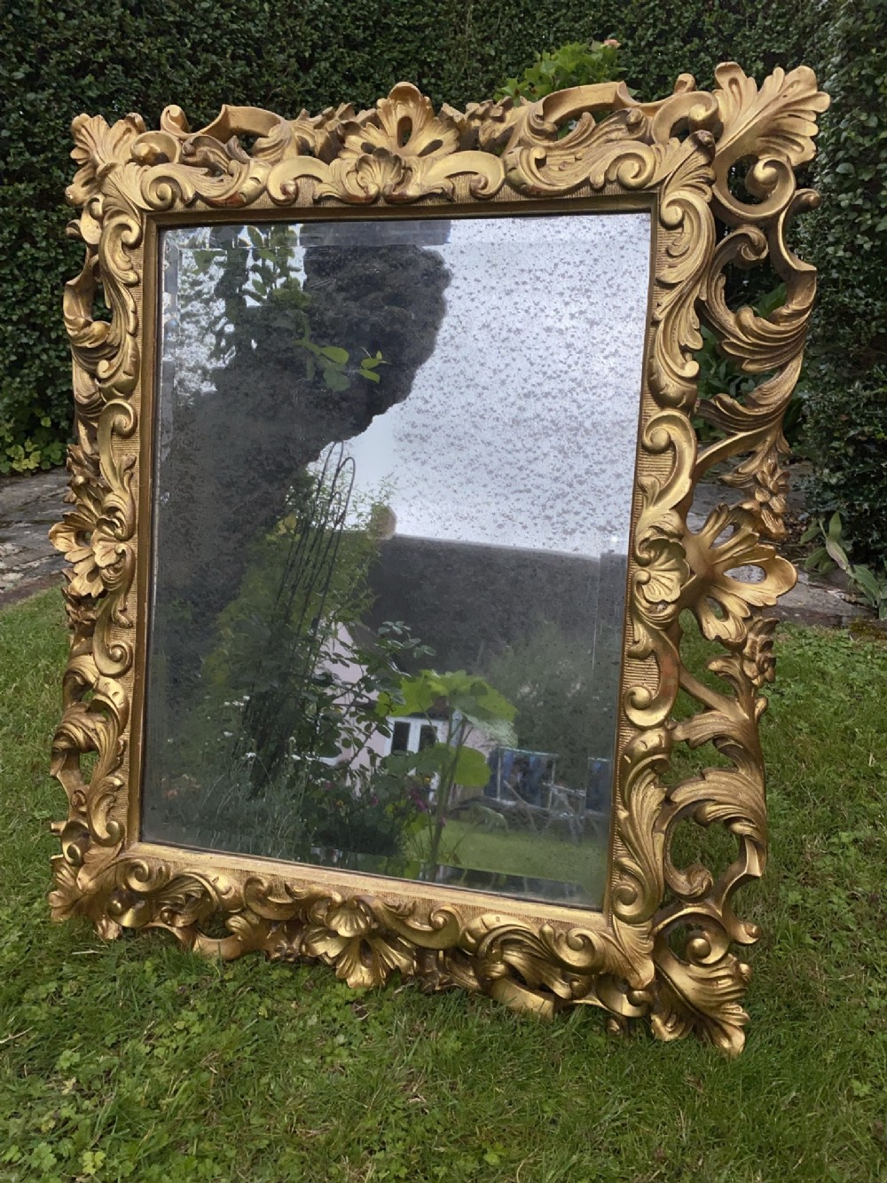 Carved giltwood cushion mirror 