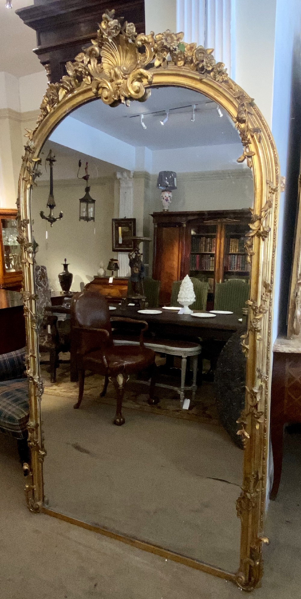 Very large arched mirror with scrolling flowers 