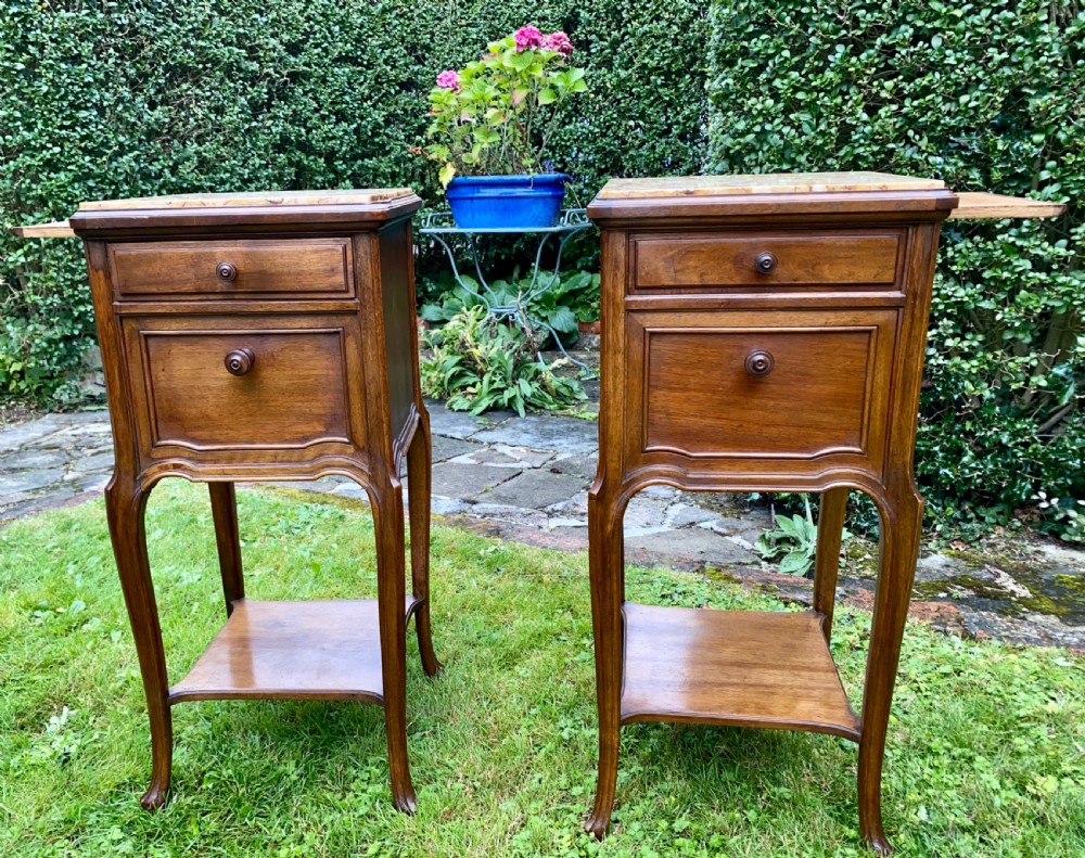 A pair of French bedside tables in walnut 