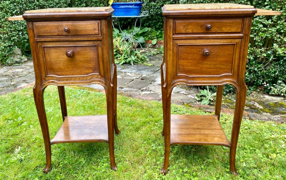 A pair of French bedside tables in walnut  View II