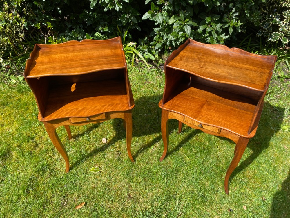 A pair of walnut bedside tables  View III