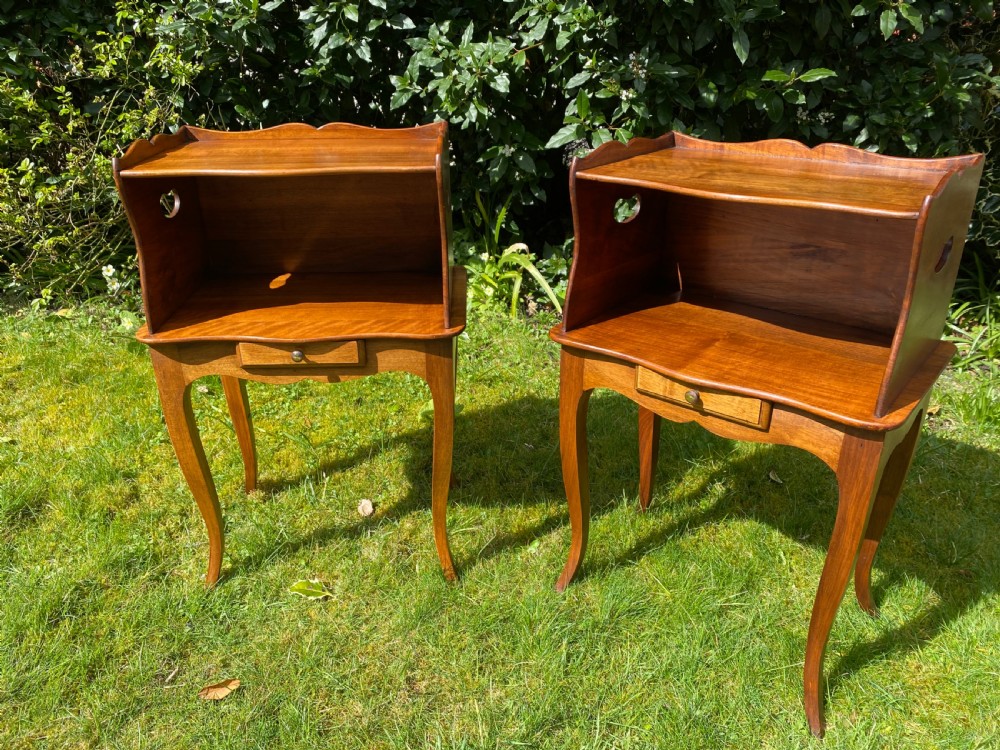 A pair of walnut bedside tables  View IV