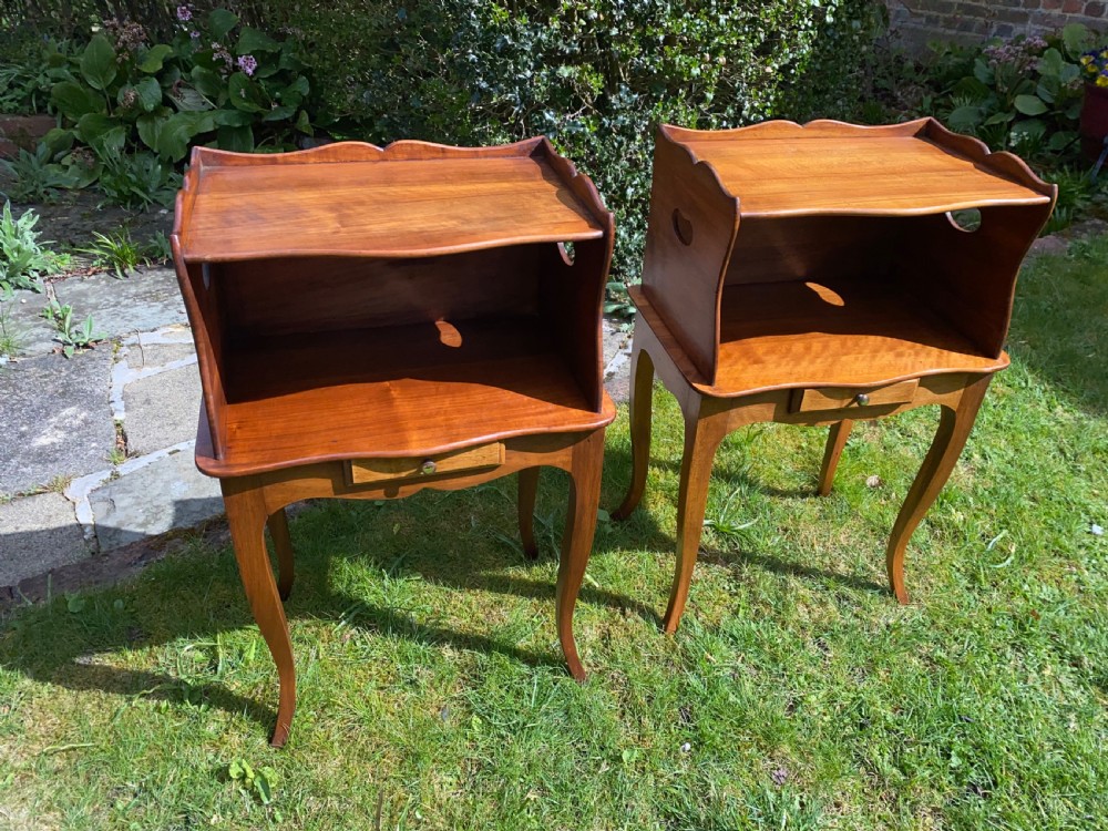 A pair of walnut bedside tables  View V
