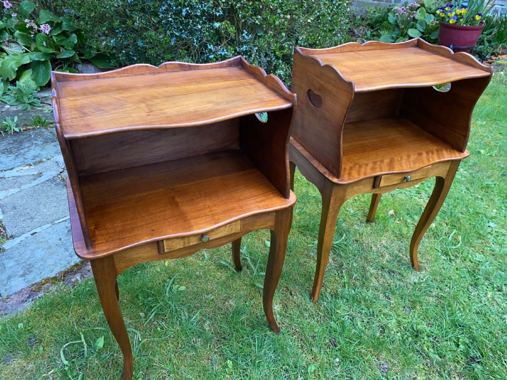 A pair of walnut bedside tables  View VI