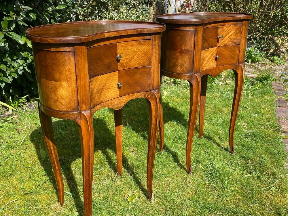 Pair of kidney shaped bedside tables 
