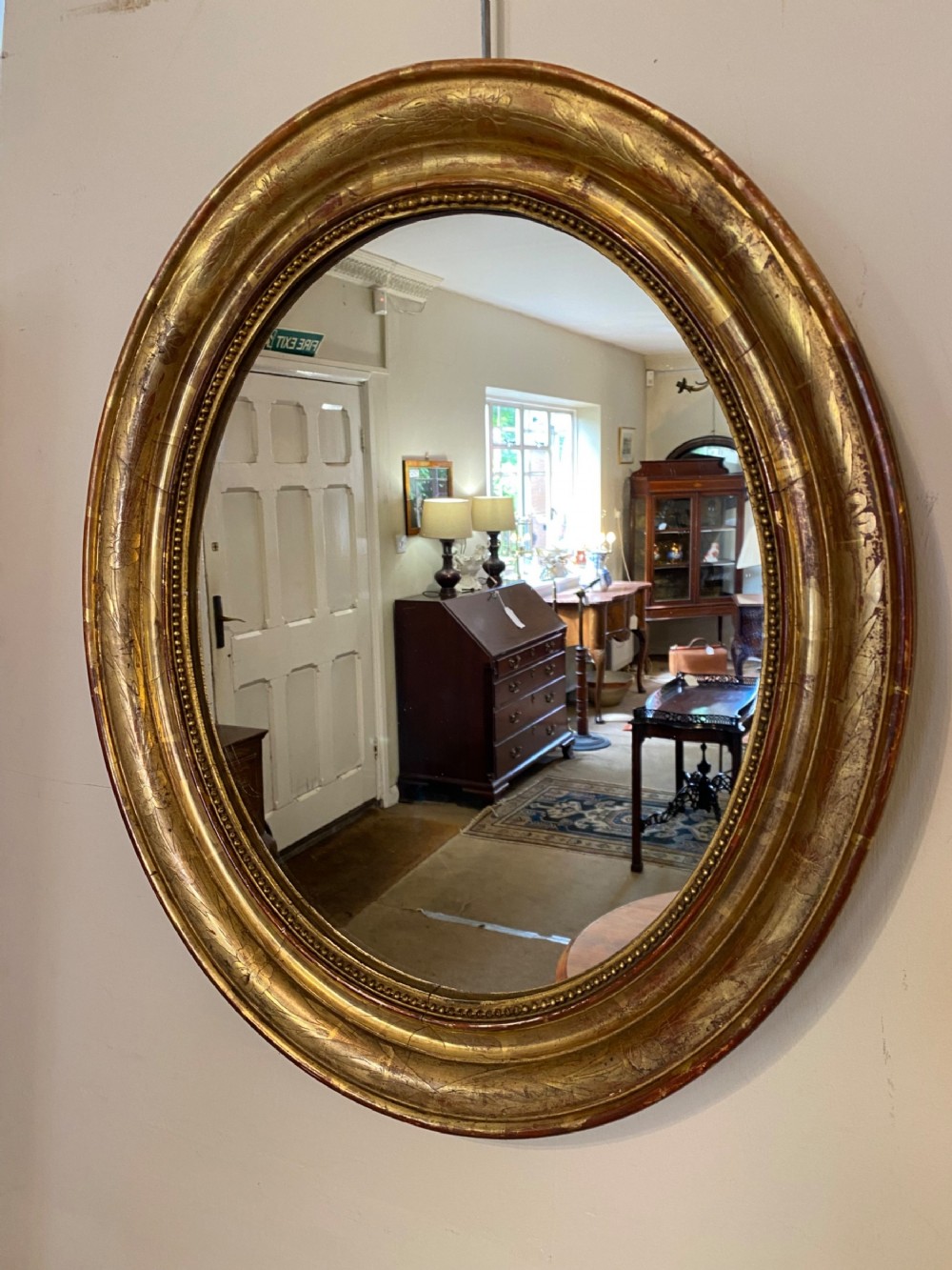 French oval mirror in gilt