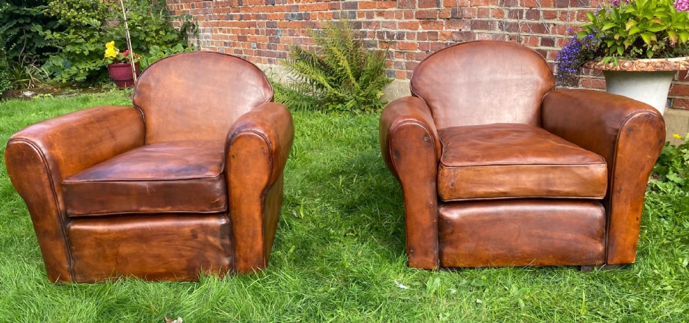Pair of large leather club chairs 