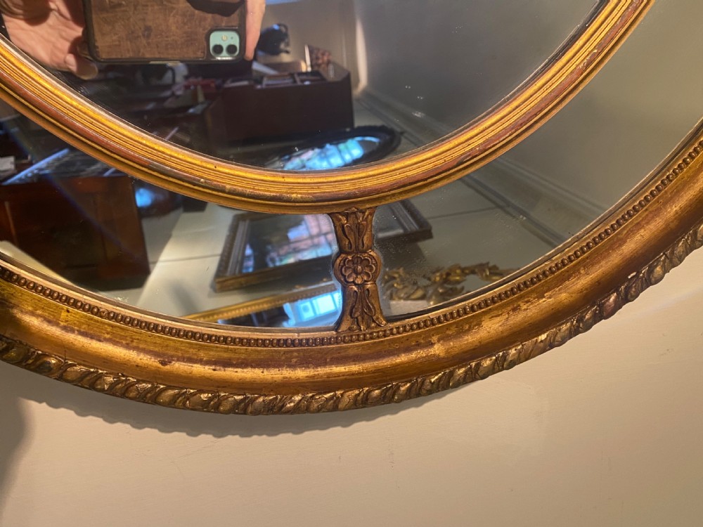 Large gilt oval mirror  View II