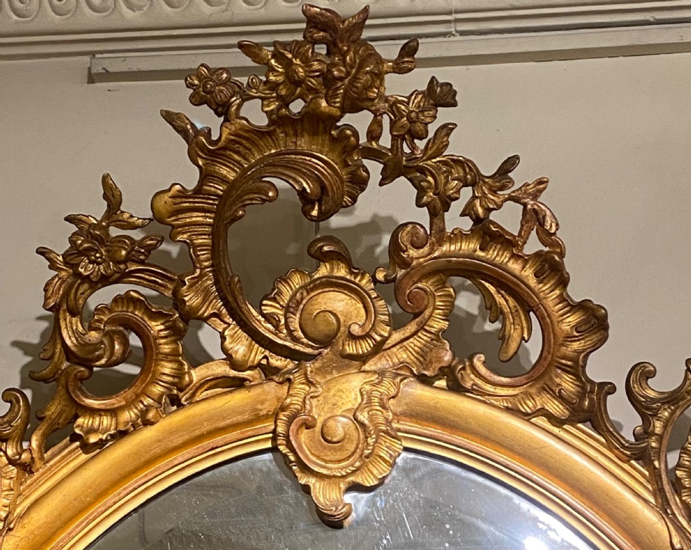 Large 19 th Century gilt oval mirror  View II