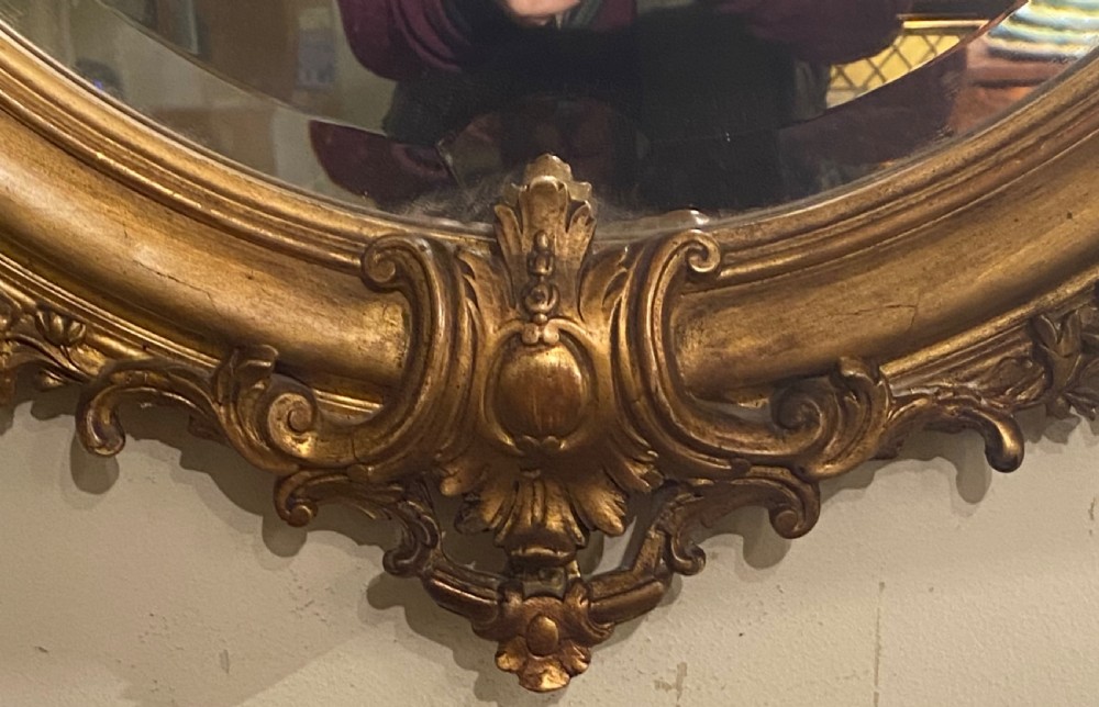 Large 19 th Century gilt oval mirror  View IV