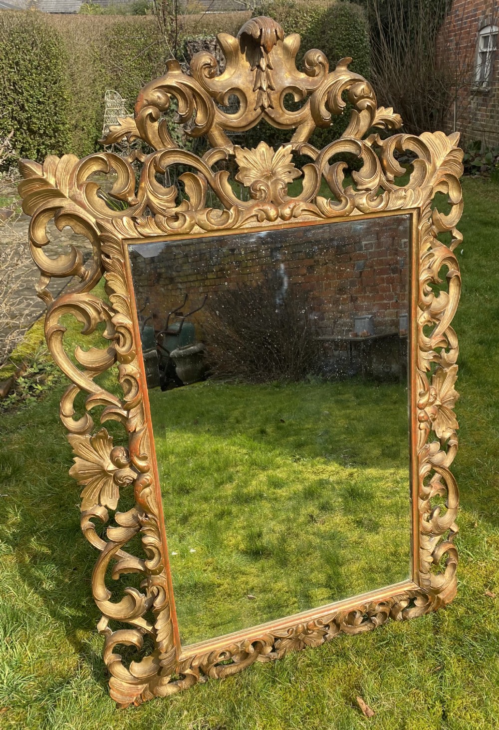 Carved giltwood cushion mirror 