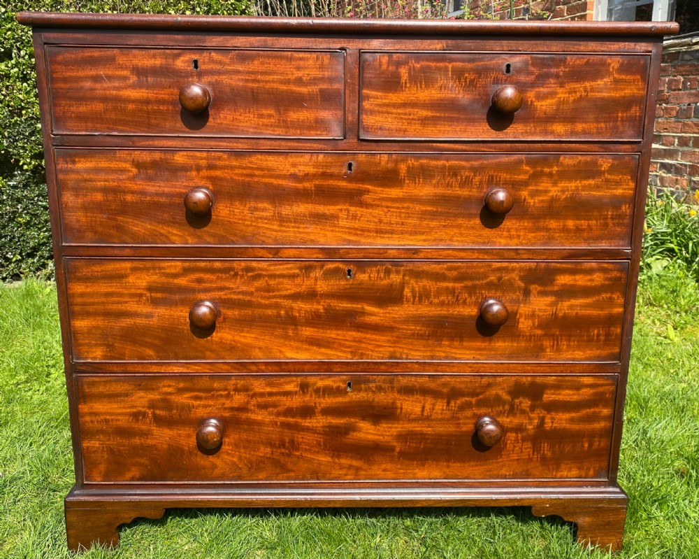 Flame Mahogany chest of drawers on bracket feet 