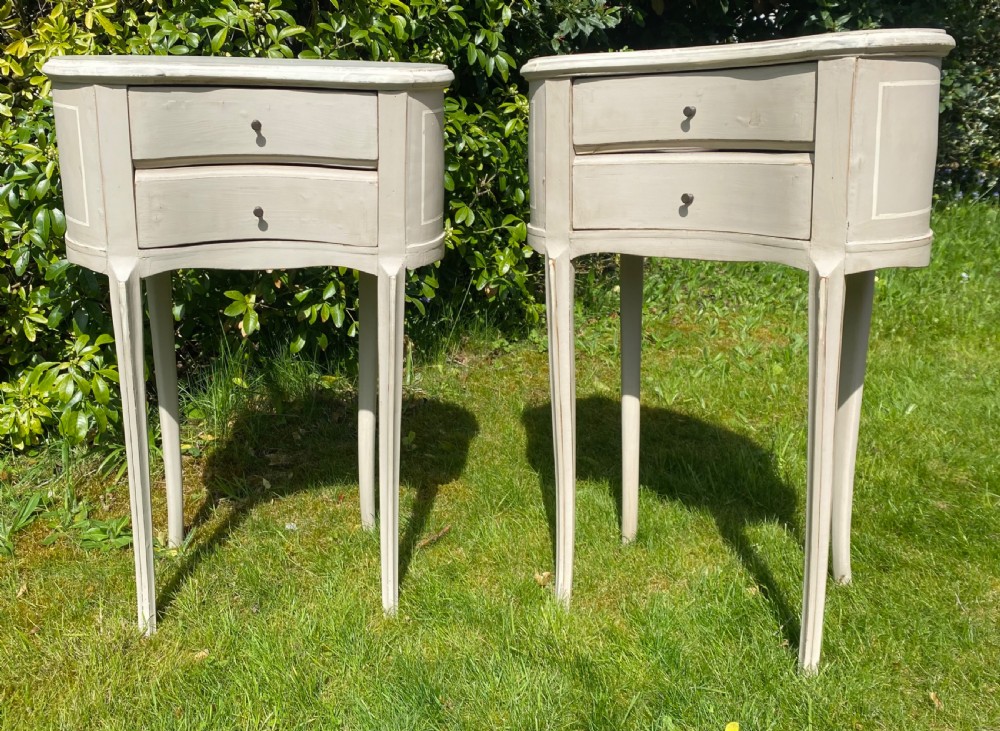 Pair of kidney shaped bedside tables 