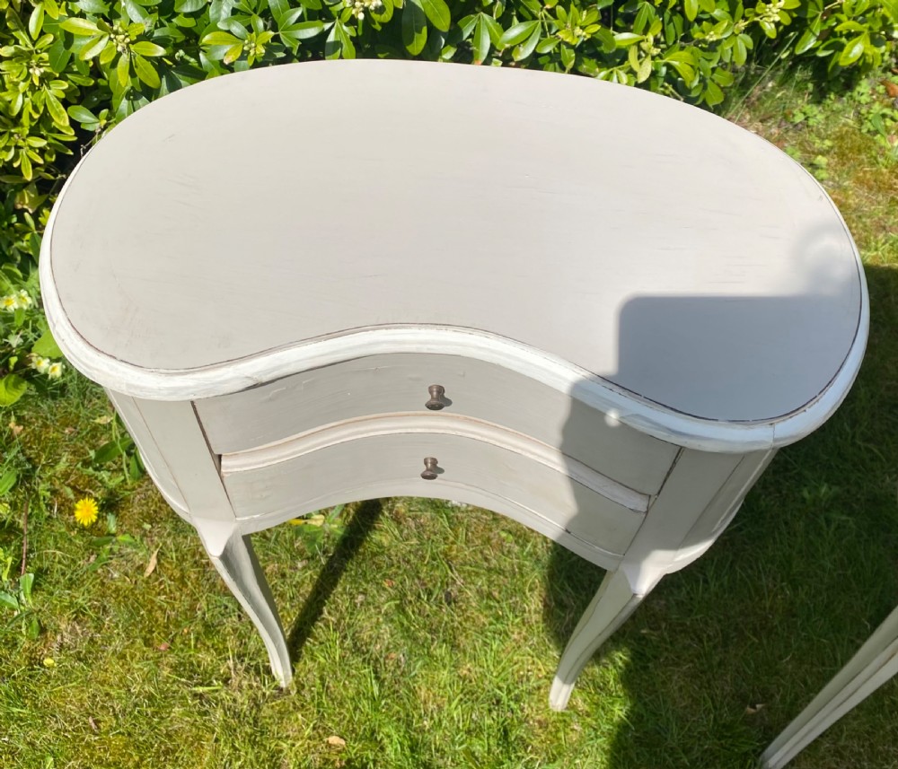 Pair of kidney shaped bedside tables  View II