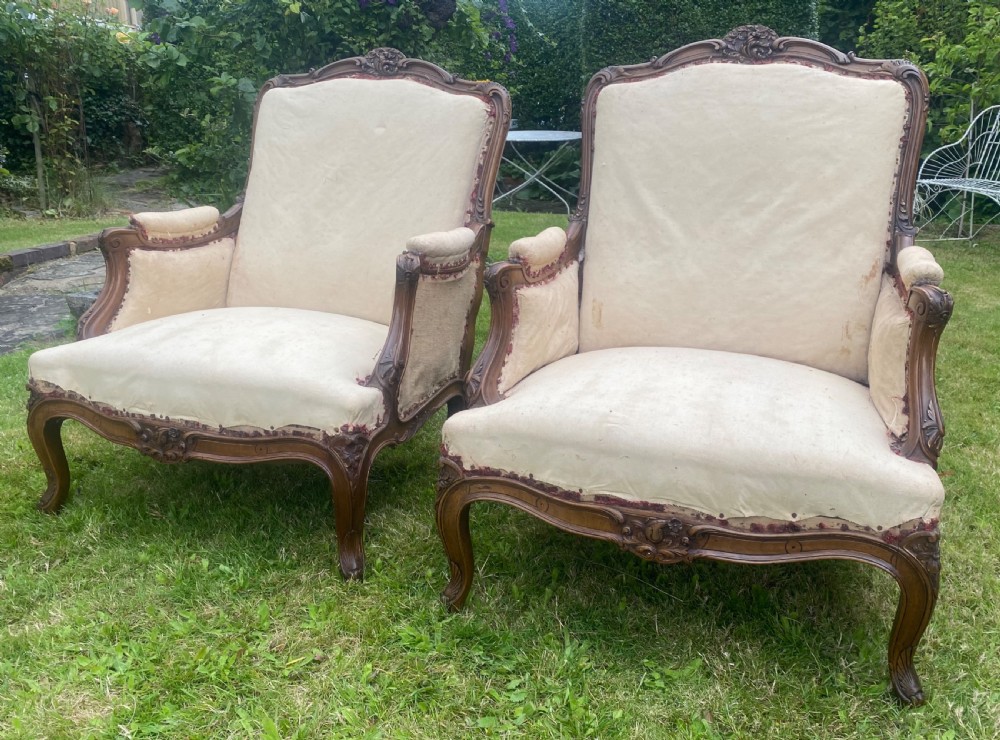 Pair of large carved walnut armchairs 