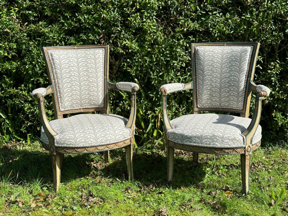 A Pair of French Neoclassical Open Armchairs 