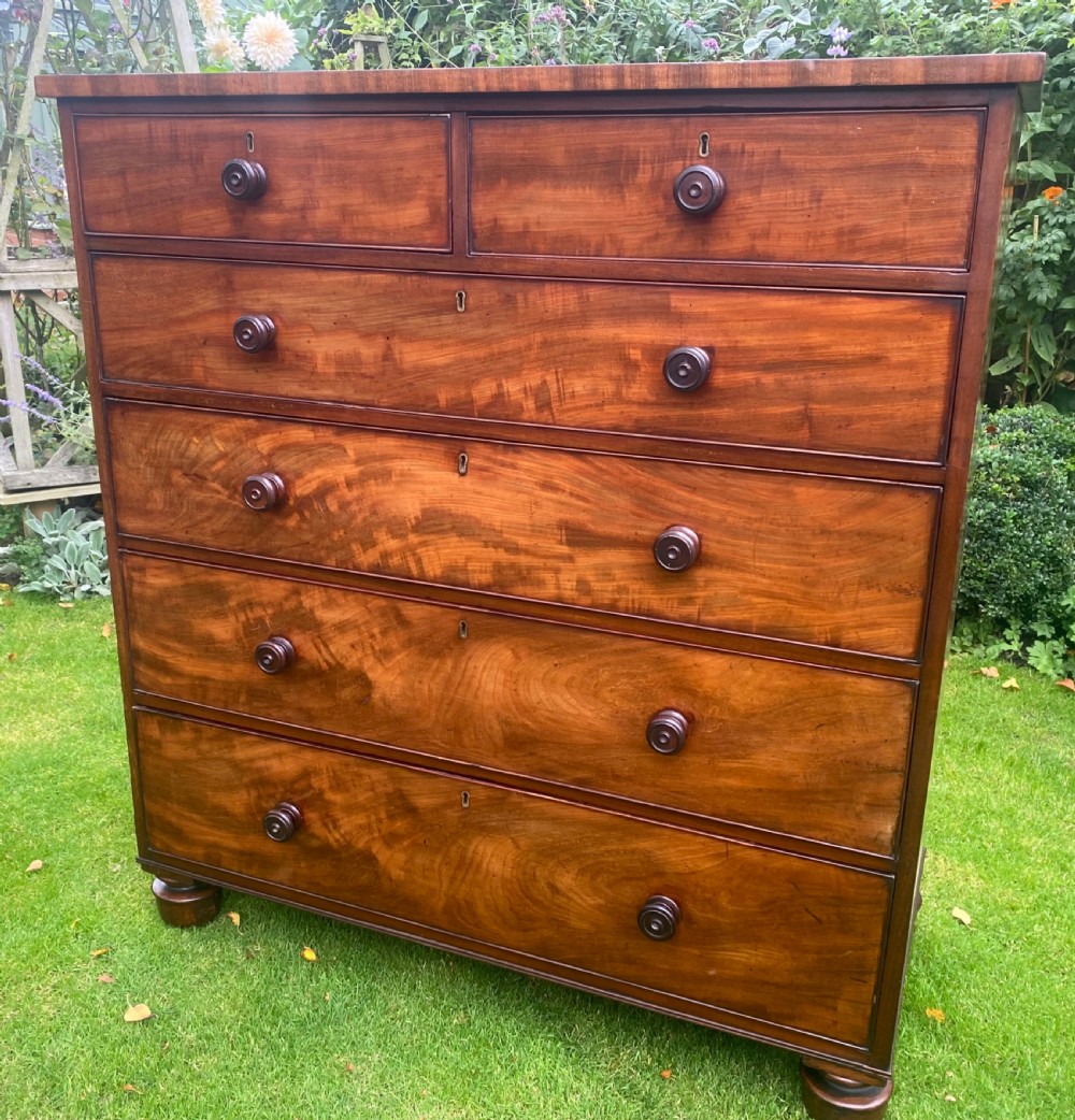 Large flame mahogany chest of drawers 