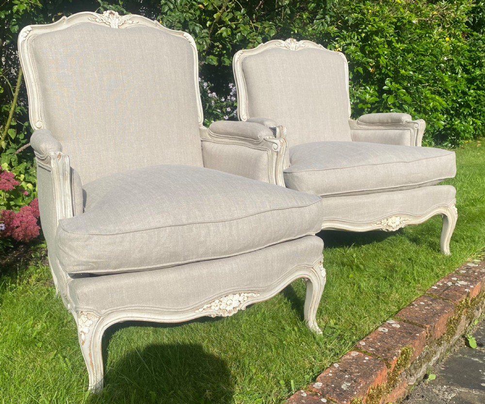 A Pair of newly upholstered French Bergere armchairs in grey linen View III