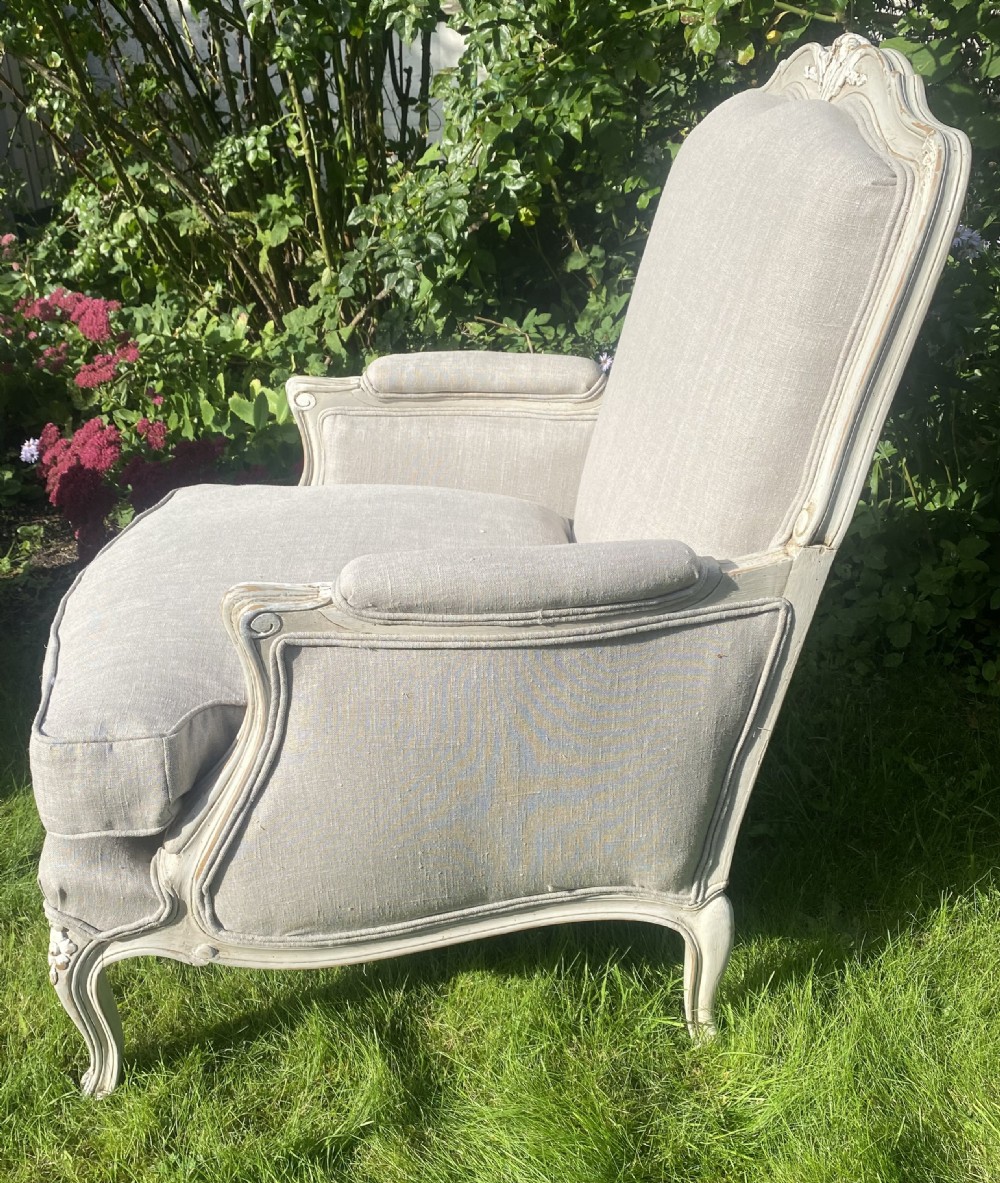 A Pair of newly upholstered French Bergere armchairs in grey linen View V