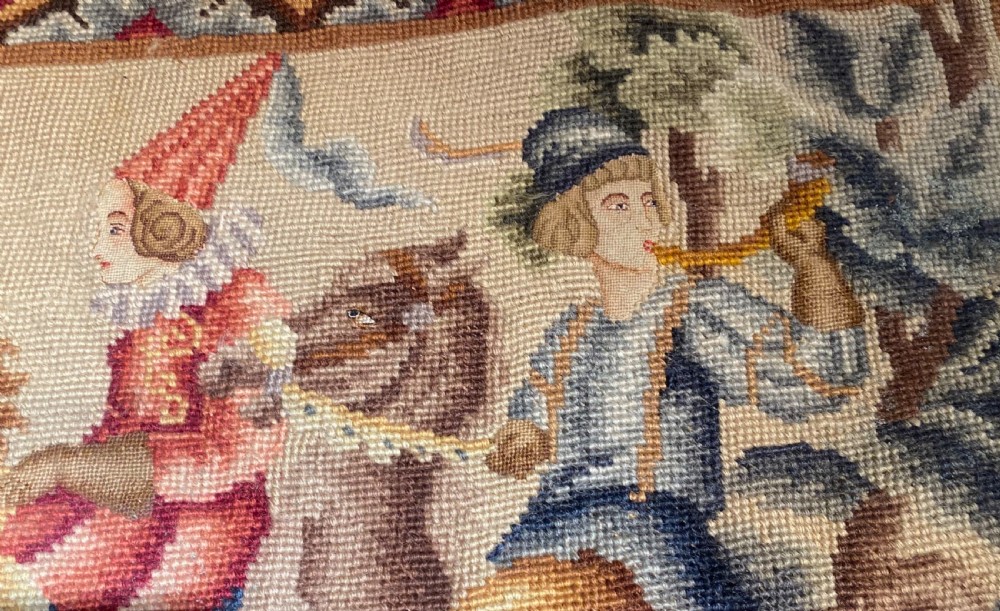 A rectangular early French needlepoint panel featuring a hunting scene with figures on horseback, hounds, and a stag within a velvet border. View II