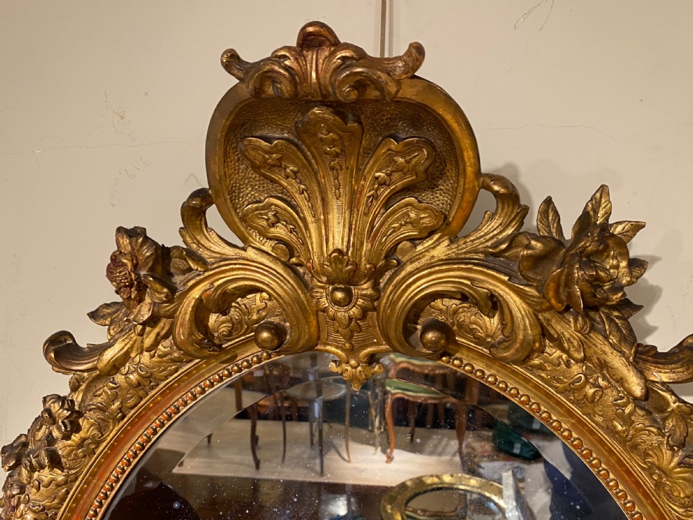Large 19th Century oval gilt mirror  View II