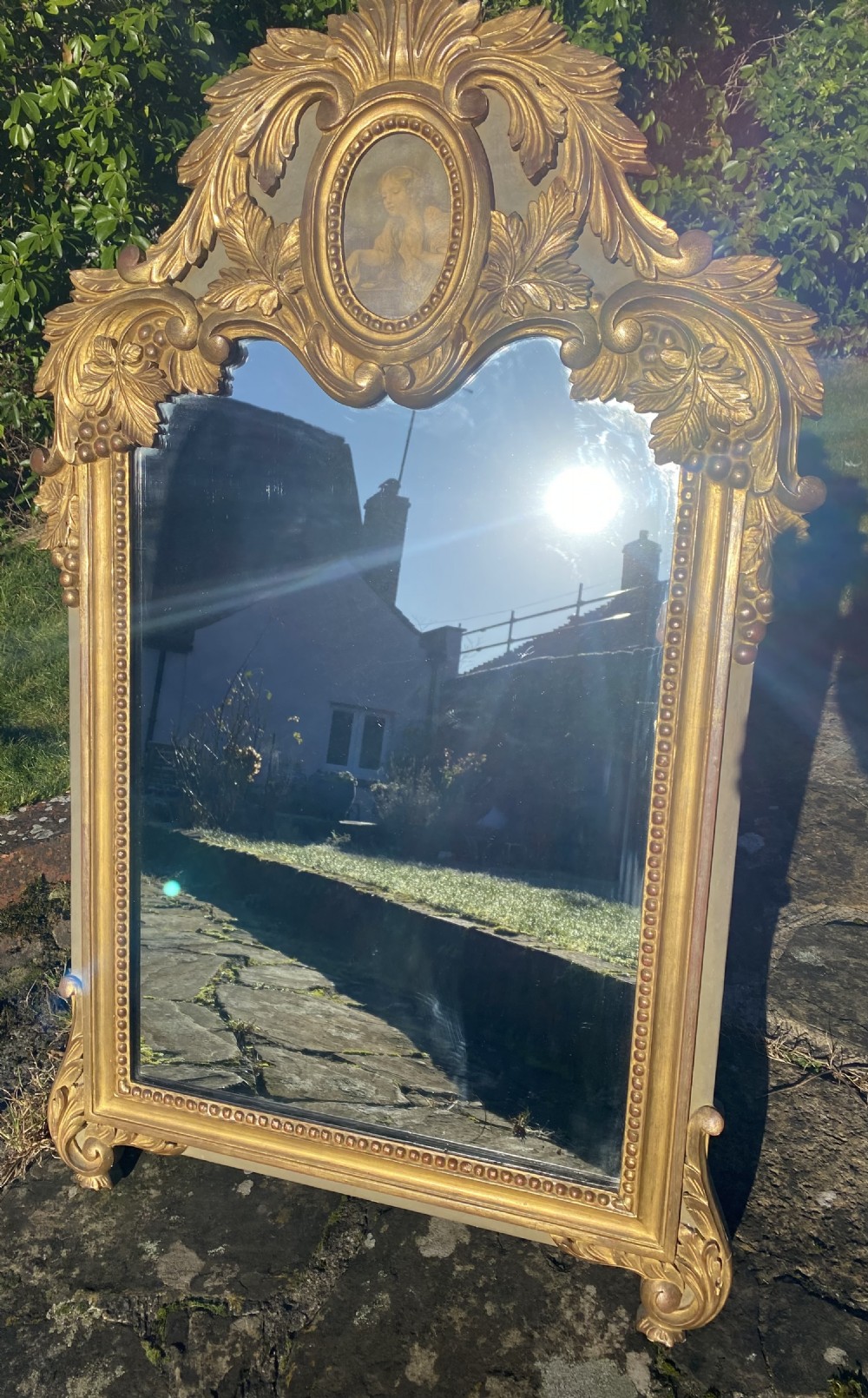 Carved giltwood wall mirror 