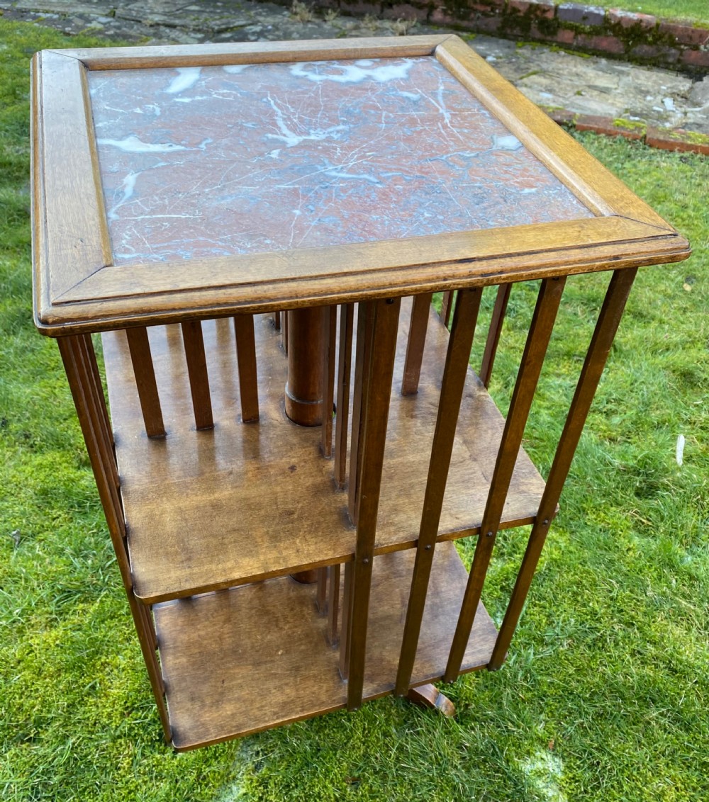 Revolving bookcase in walnut with marble top View II