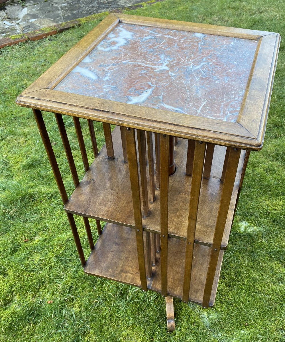 Revolving bookcase in walnut with marble top View IV