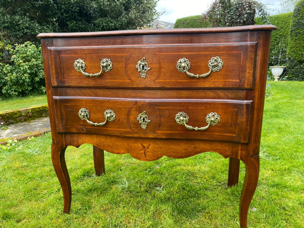 Small walnut serpentine fronted commode  View II