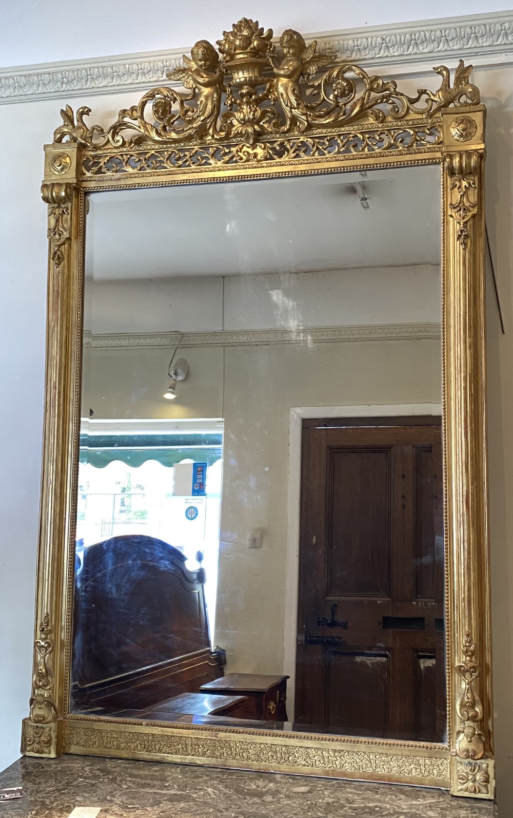 Large gilt mirror with cherubs 