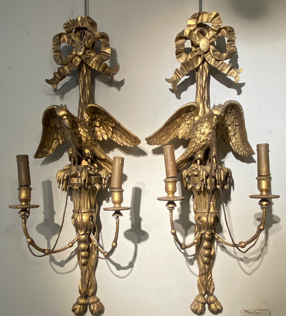Pair of carved giltwood wall lights