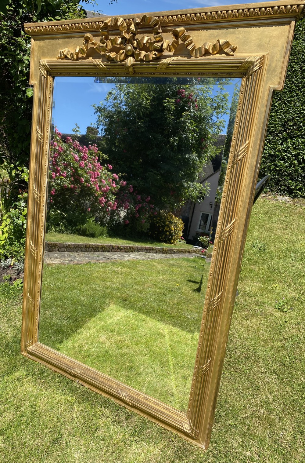Large gilt mirror with bow decoration 