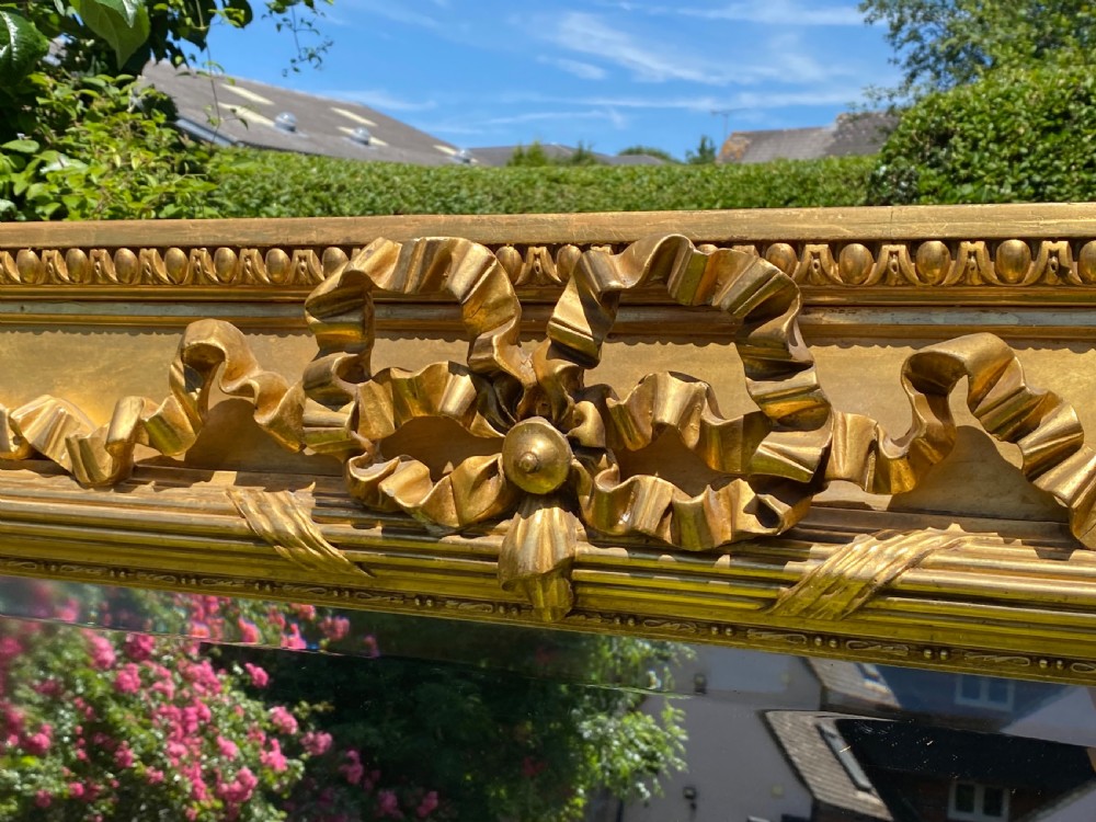Large gilt mirror with bow decoration  View III
