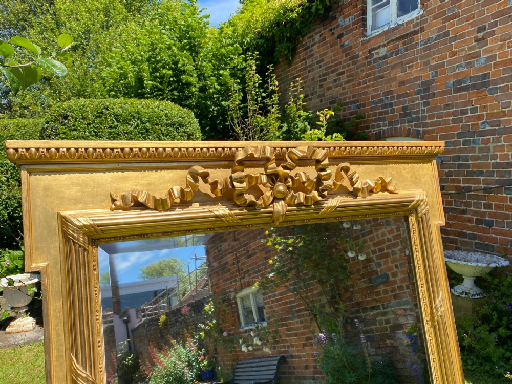 Large gilt mirror with bow decoration  View VII