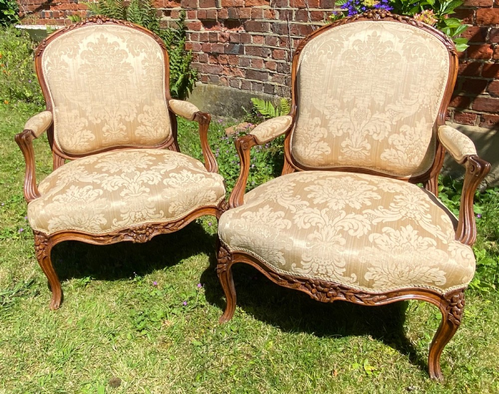 Pair of carved walnut armchairs 