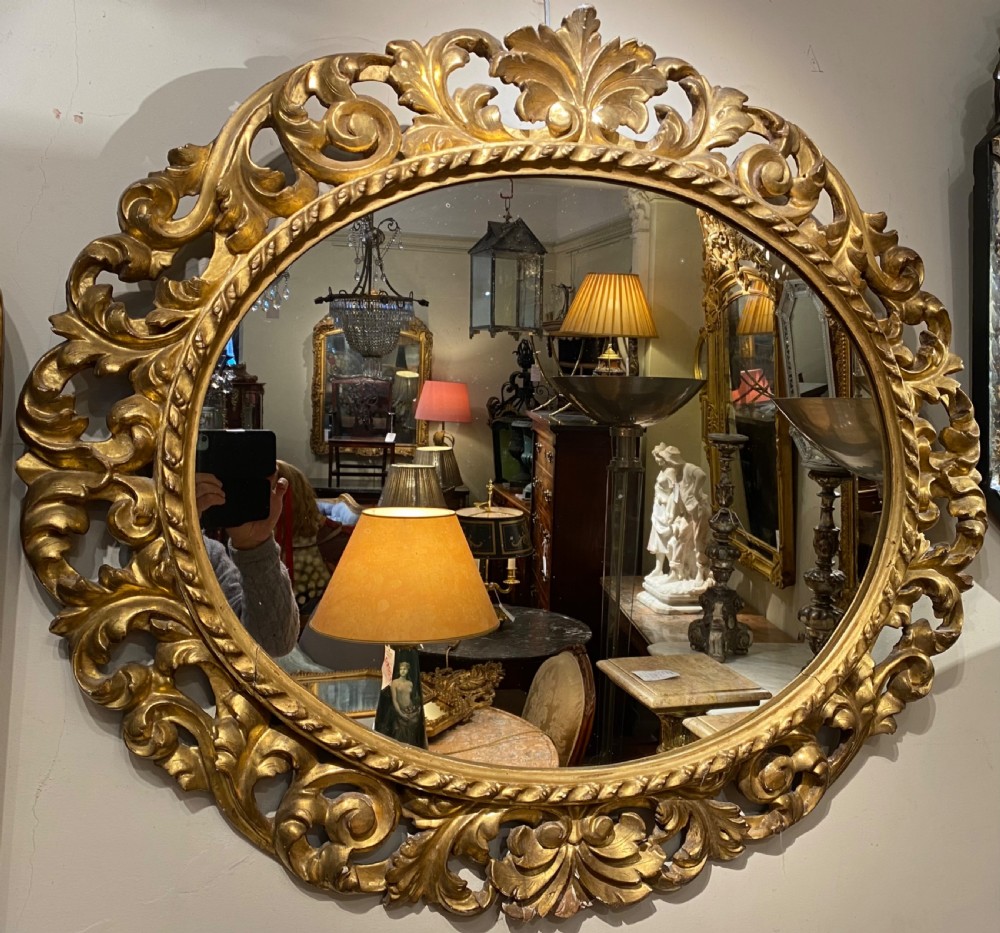 Early carved giltwood oval mirror View II