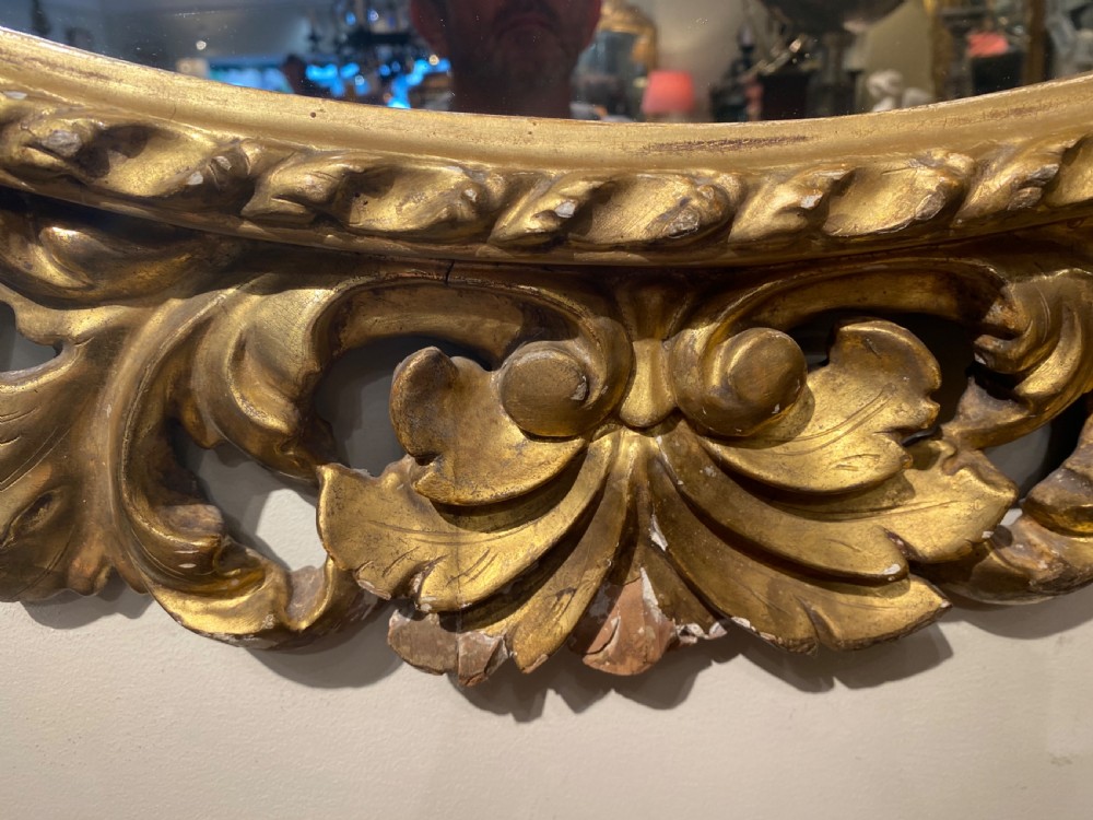 Early carved giltwood oval mirror View III